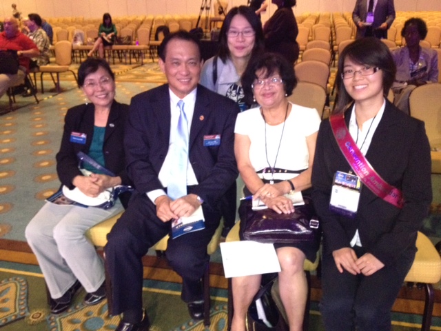 Fellow Podium Toastmaster member Janet sitting with our 2012-2013 International President John L.